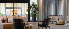 An elegant modern lobby with lush indoor plants